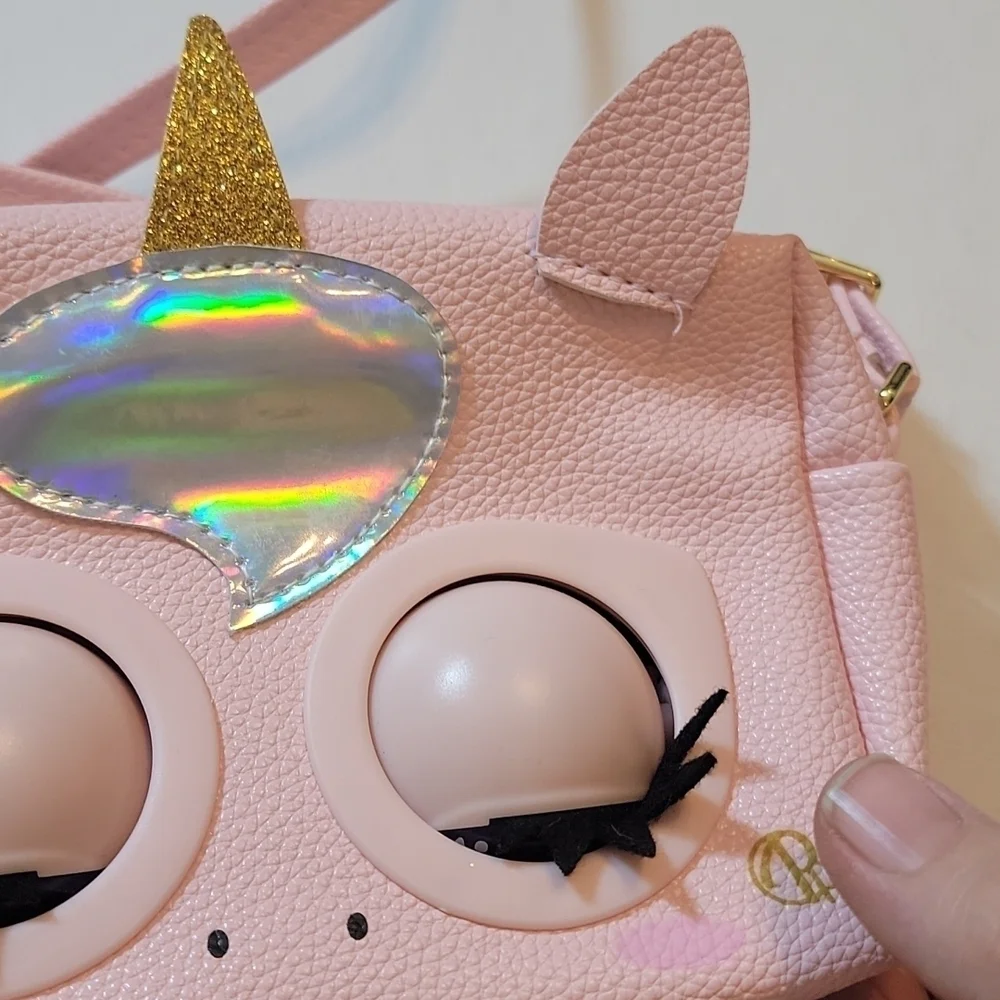 Purse pets pink purse. For 5 yr Olds plus. Comes with batteries and instructions